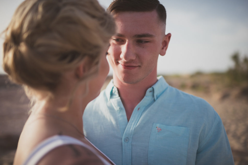 American couple proudly serving their country photo shoot, on the beach of Chania - Wedding Photographer